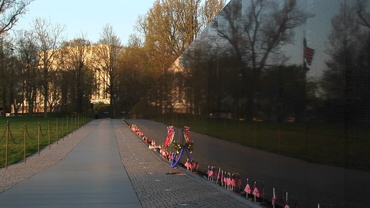 In Front Of The Vietnam Veterans Memorial Wall Ribbons On Tributes And Mementos Flutter In The Breeze 1