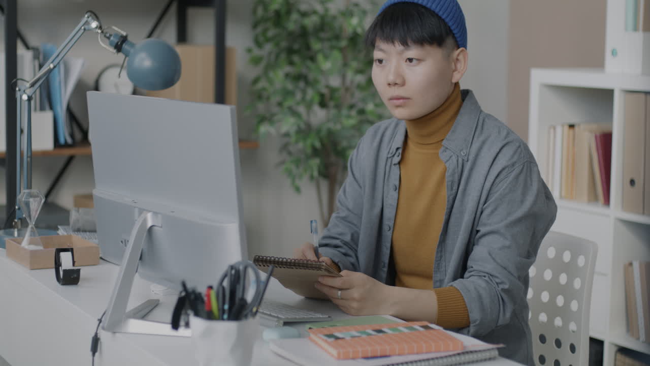 Woman working at a home office desk