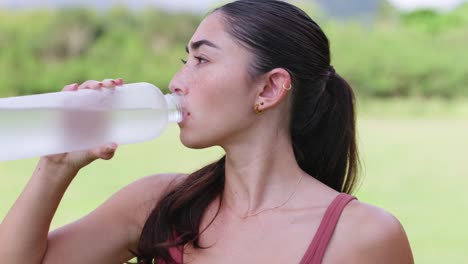 fitness model drinking from water bottle, medium, centered