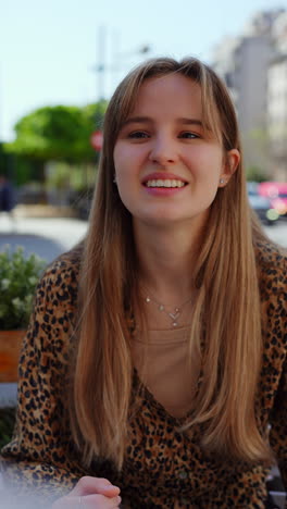 Happy Woman at Outdoor Cafe