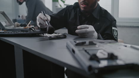 forensic technician examining evidence at a crime scene