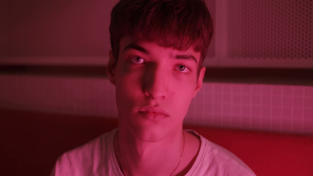Portrait of a Young Man in Red Lighting
