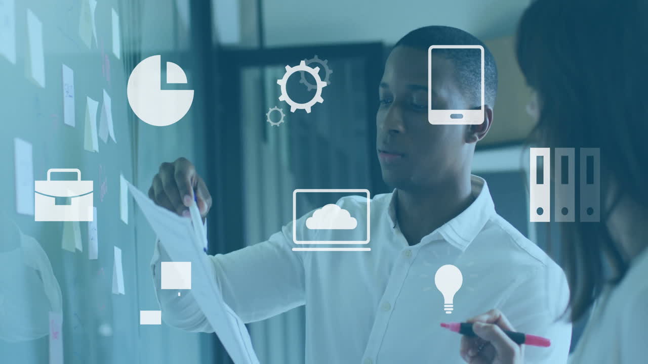 Discussing documents, business professionals with digital animation icons in office meeting