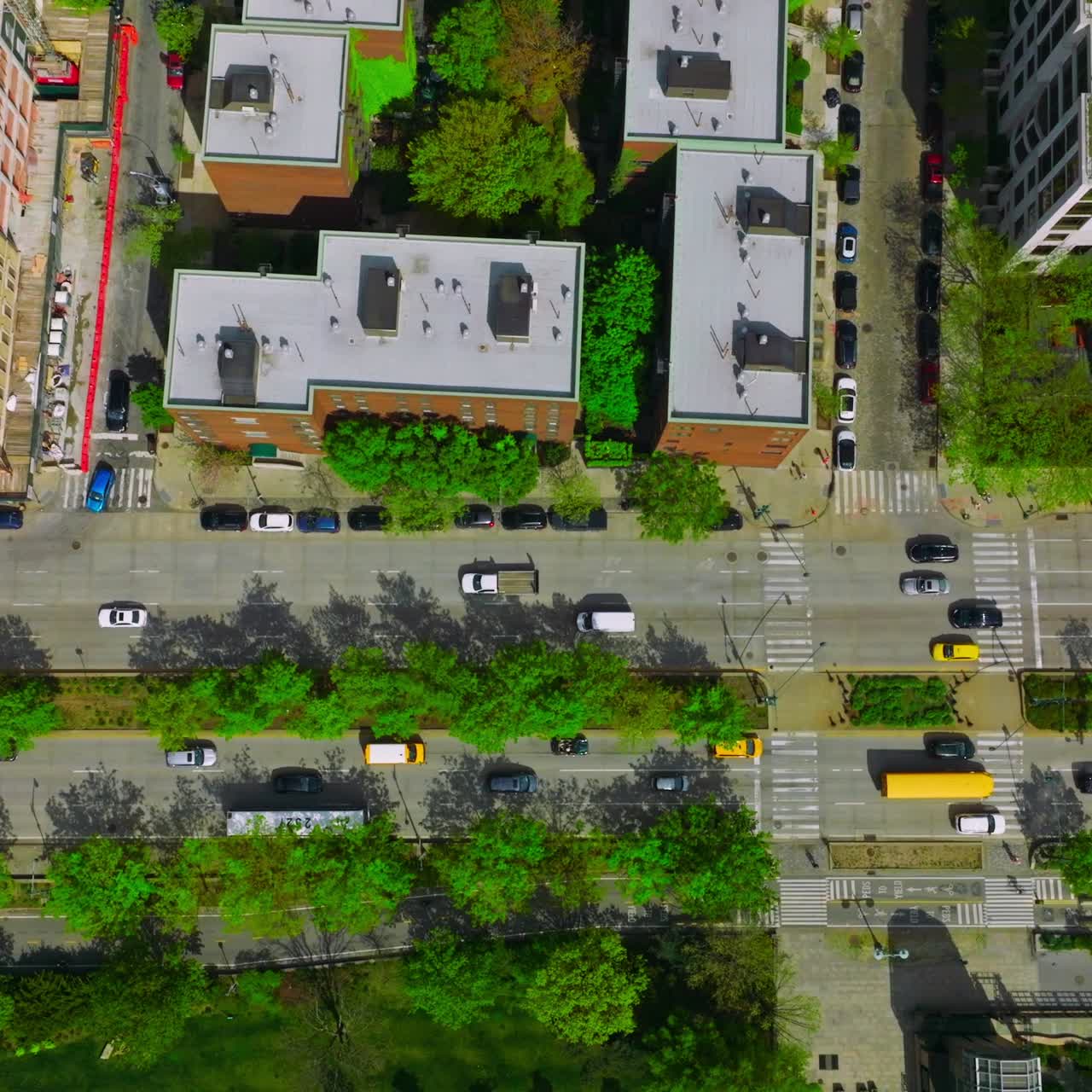 Numerous cars driving along the busy roads. Crazy traffic of metropolis at daytime. Aerial perspective