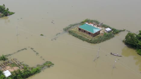 aerial: submerged village during a flood in bangladesh, asia, pan drone shot