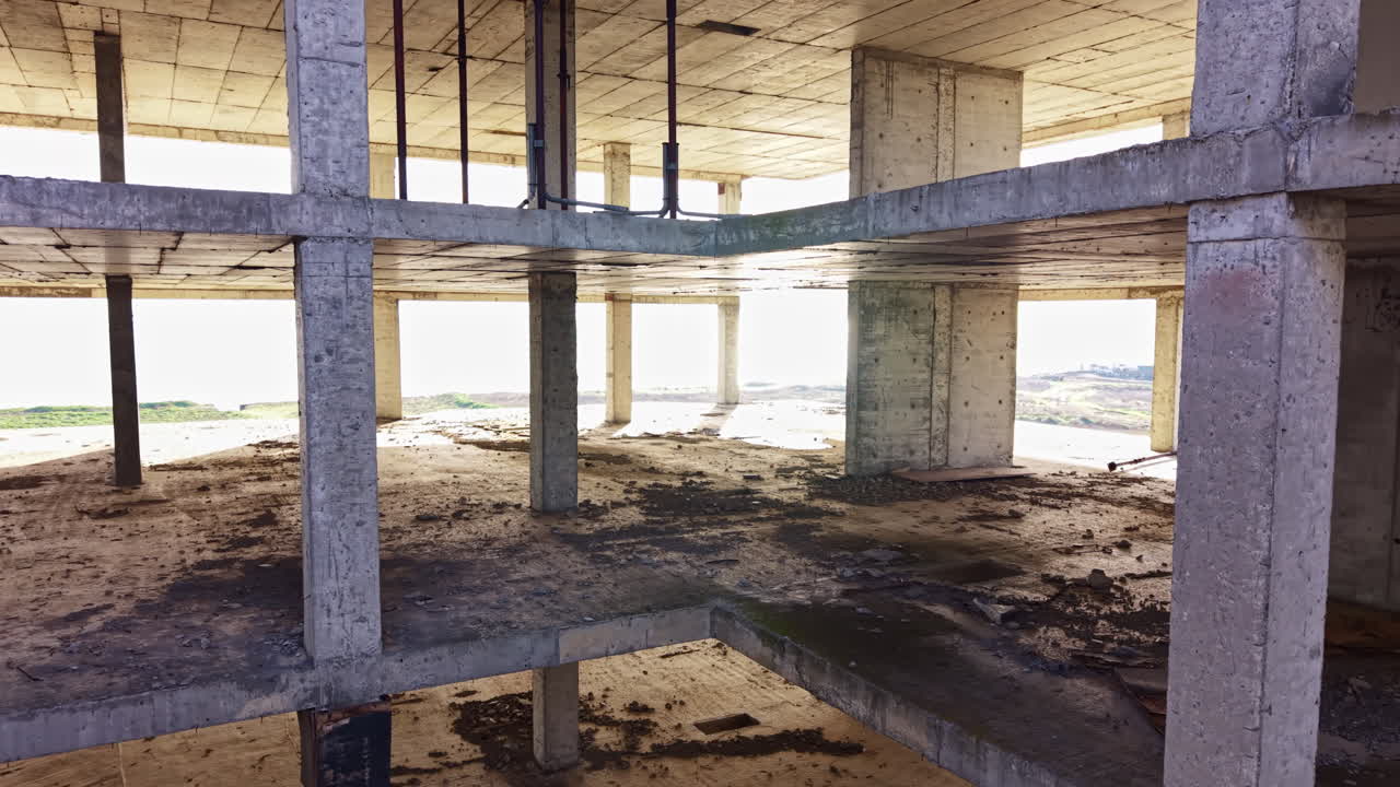 Urban exploration reveals the beauty of an unfinished concrete structure bathed in natural light at dusk
