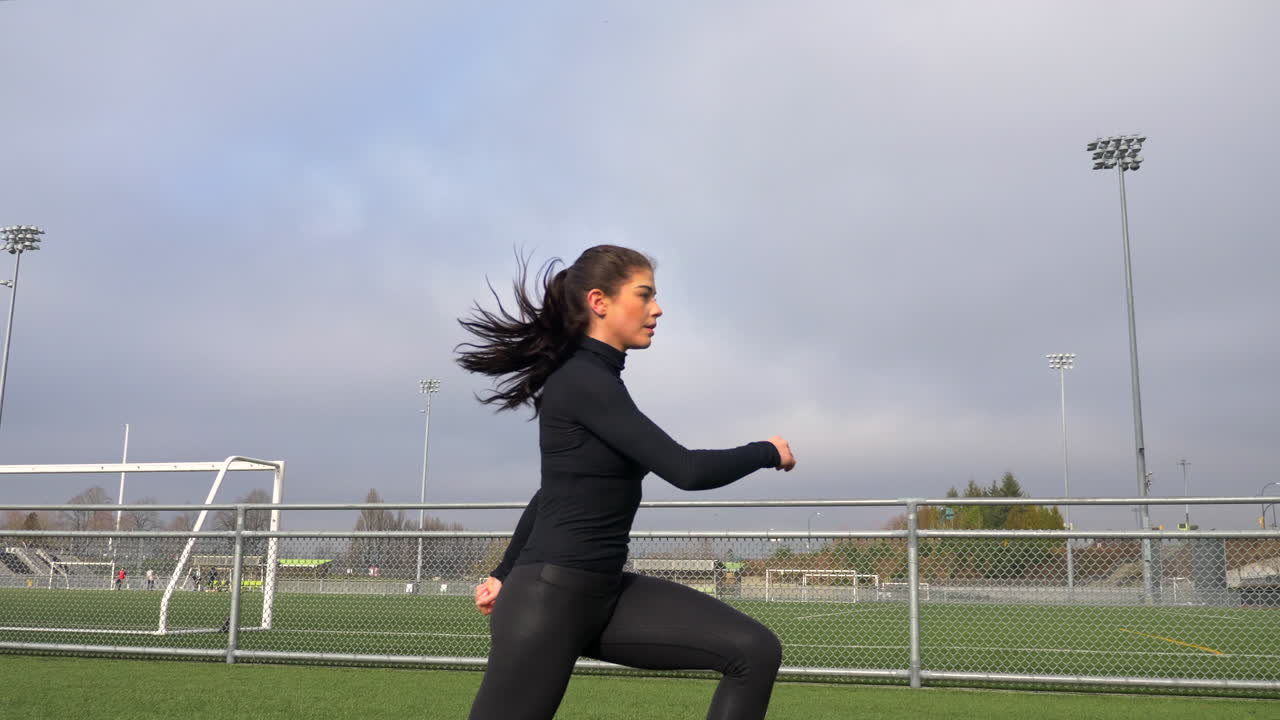Slim Woman Exercising Outdoor, Warming Up With Squat Exercises