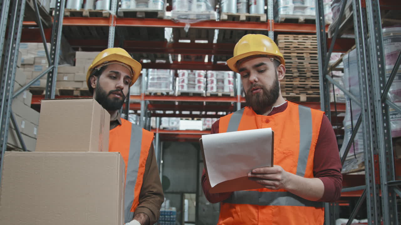 Workers Walking Through Warehouse