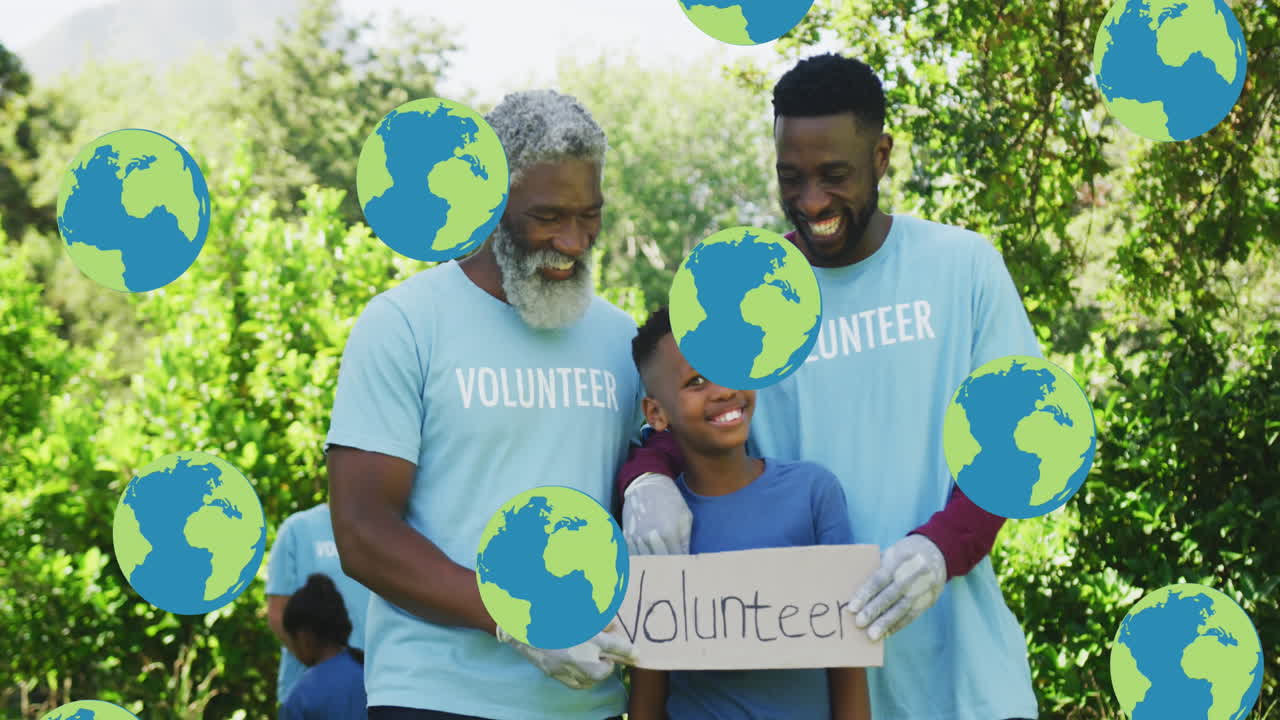 Animation of globes over happy african american father, son and grandfather cleaning up countryside