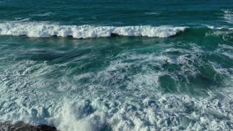 breathtaking slow motion view of ocean waves crawling in foamy surface