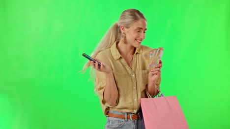 mujer feliz, teléfono y bolsas de compras en verde