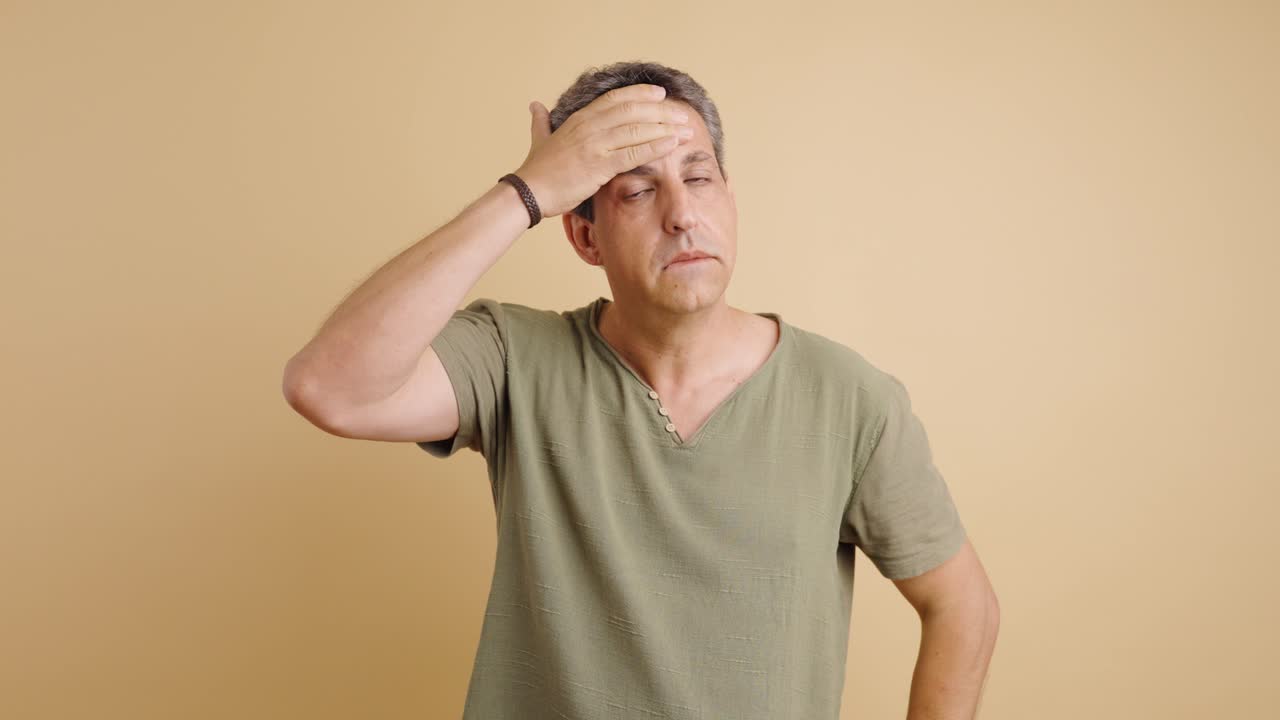 A man experiencing stress or a headache