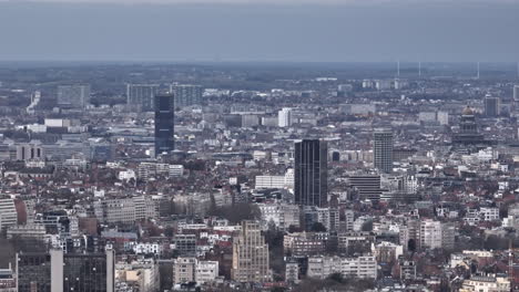 clouds hover as brussels' aerial expanse marries historic streets with modern