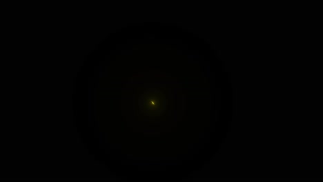 yellow glowing particles on black background