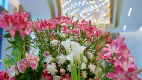 pink and white flowers decoration at the entrance of hotel push out shot