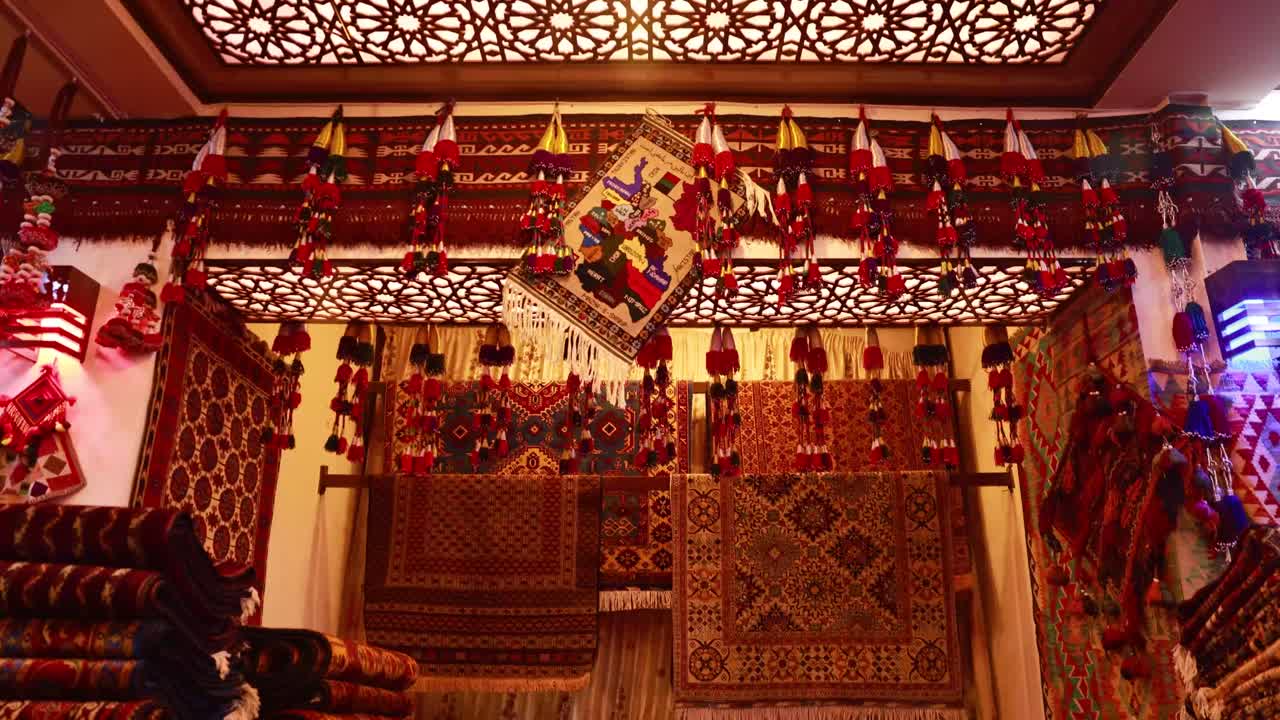 Vibrant Traditional Afghan Carpet, Detailed shot of a richly patterned, colorful traditional carpet from Afghanistan.
