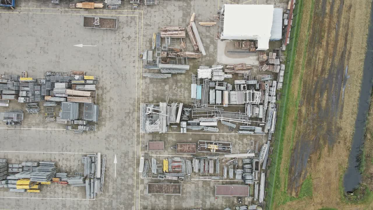 Top down aerial of construction materials on a industrial storage yard