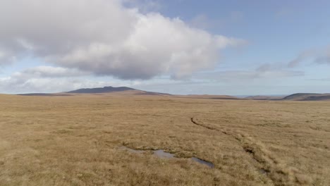 Aerial-tracking-low-and-fast-above-the-moorland-of-the-A-Mhoine-peninsula-in-Sutherland-Scotland