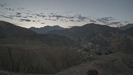 sunrise/sunset over a himalayan monastery valley