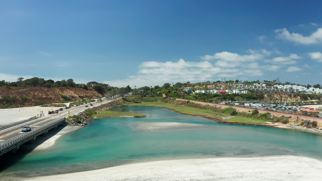 Aerial shot above PCH, the lagoon and beach in Del Mar, CA