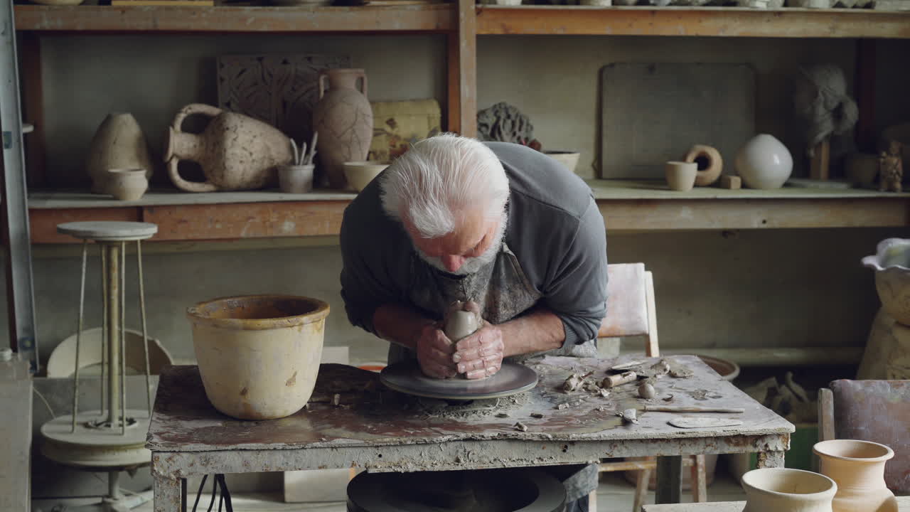 Senior Potter Working on Pottery Wheel