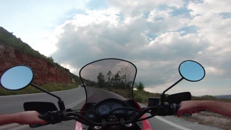 riding a motorcycle on penteli mountain in greece