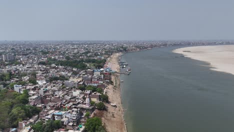 aerial footage showcasing the densely packed neighborhoods of varanasi, where the sacred river provides a constant, calming presence.