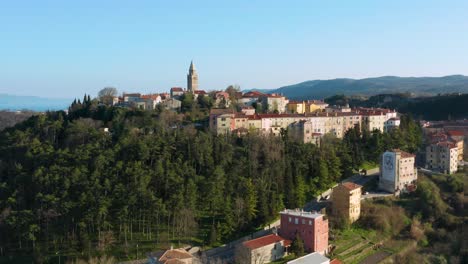 Aerial-shot-circling-around-the-old-town-of-Labin,-Croatia-on-a-bright-clear-day