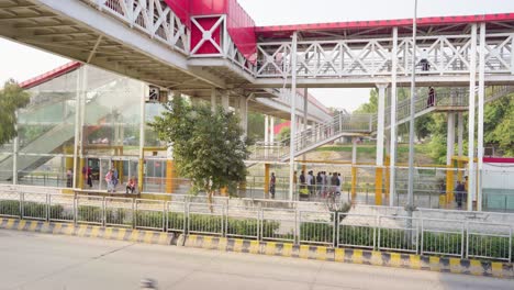 scenic urban infrastructure: metro bus station with highway view, pedestrian bridge, and city commute