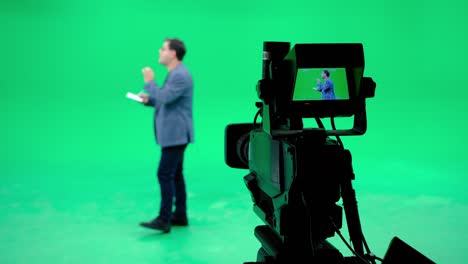 the camera announcer follows in a professional green screen studio. film and television industry