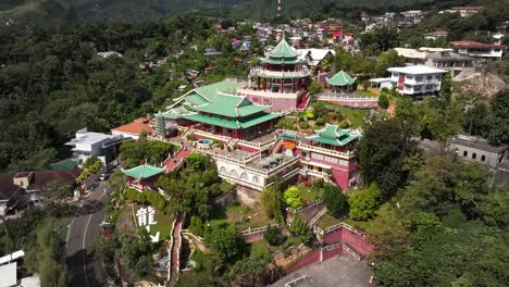 high aerial view over the taoist temple in cebu city philippines and the beverly hills neighborhood