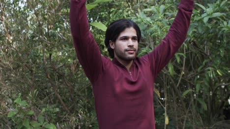 caucasian man practicing yoga meditation in nature, slow motion
