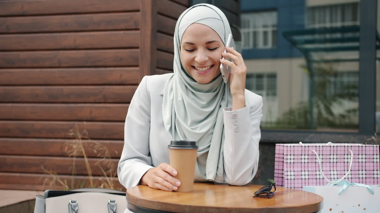 Woman in Hijab Enjoying a Coffee Break