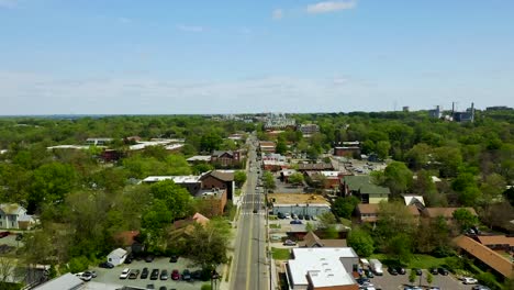 drone push in on small town usa downtown carrboro north carolina in the summer