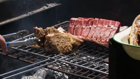 grilling chops and lamb on a barbecue, braai