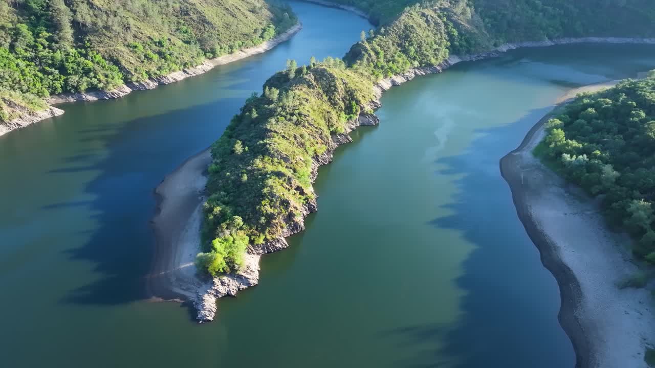 Aerial View of a Winding River Through Lush Green Landscape