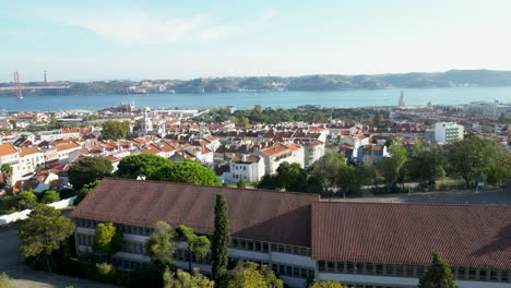 aerial view of lisbon portugal and 25 de abril bridge suspension bridge over tagus river