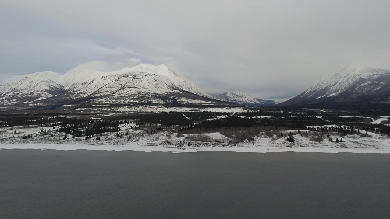 Bennett Lake Overlooking Caribou Mountain Peaks Near Carcross, Yukon, Canada. Aerial Wide Shot
