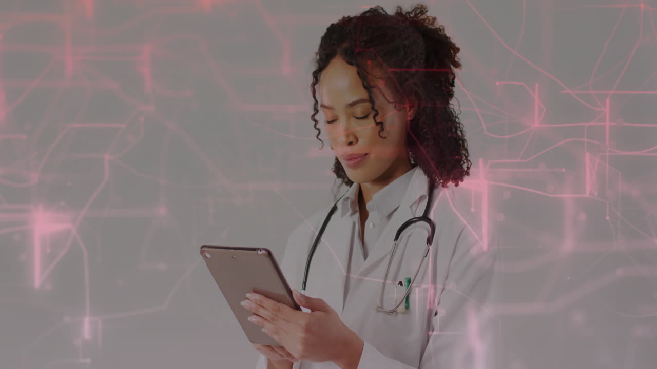 Using tablet with digital network animation, healthcare professional in hospital