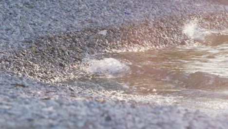 crashing waves at a stony lakeshore