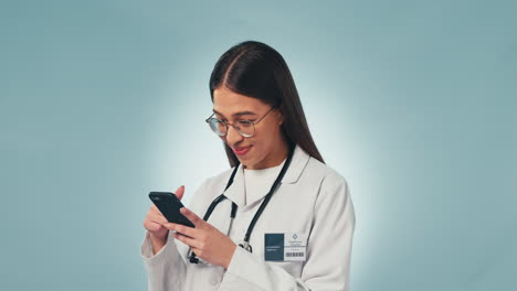 Doctor,-woman-and-phone-for-texting-in-studio