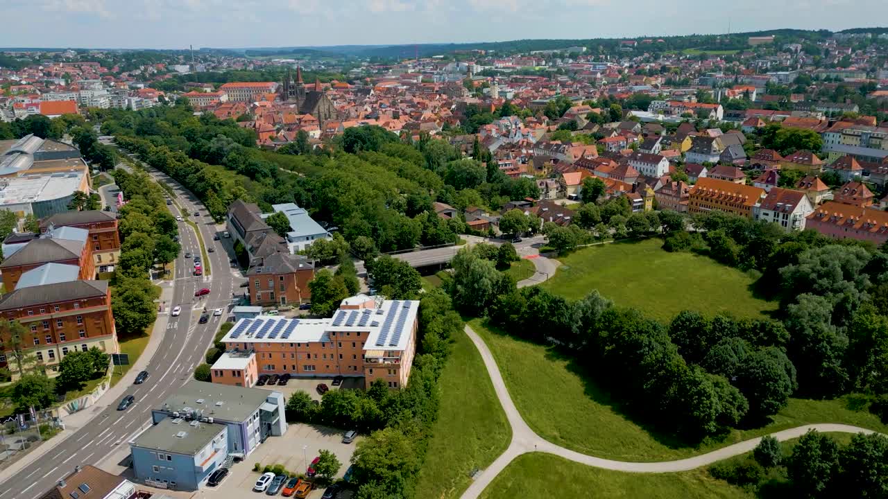 4K Aerial Drone Video of Rezatparkplatz West Parking Lot on the Frankische Rezat River in Ansbach, Germany