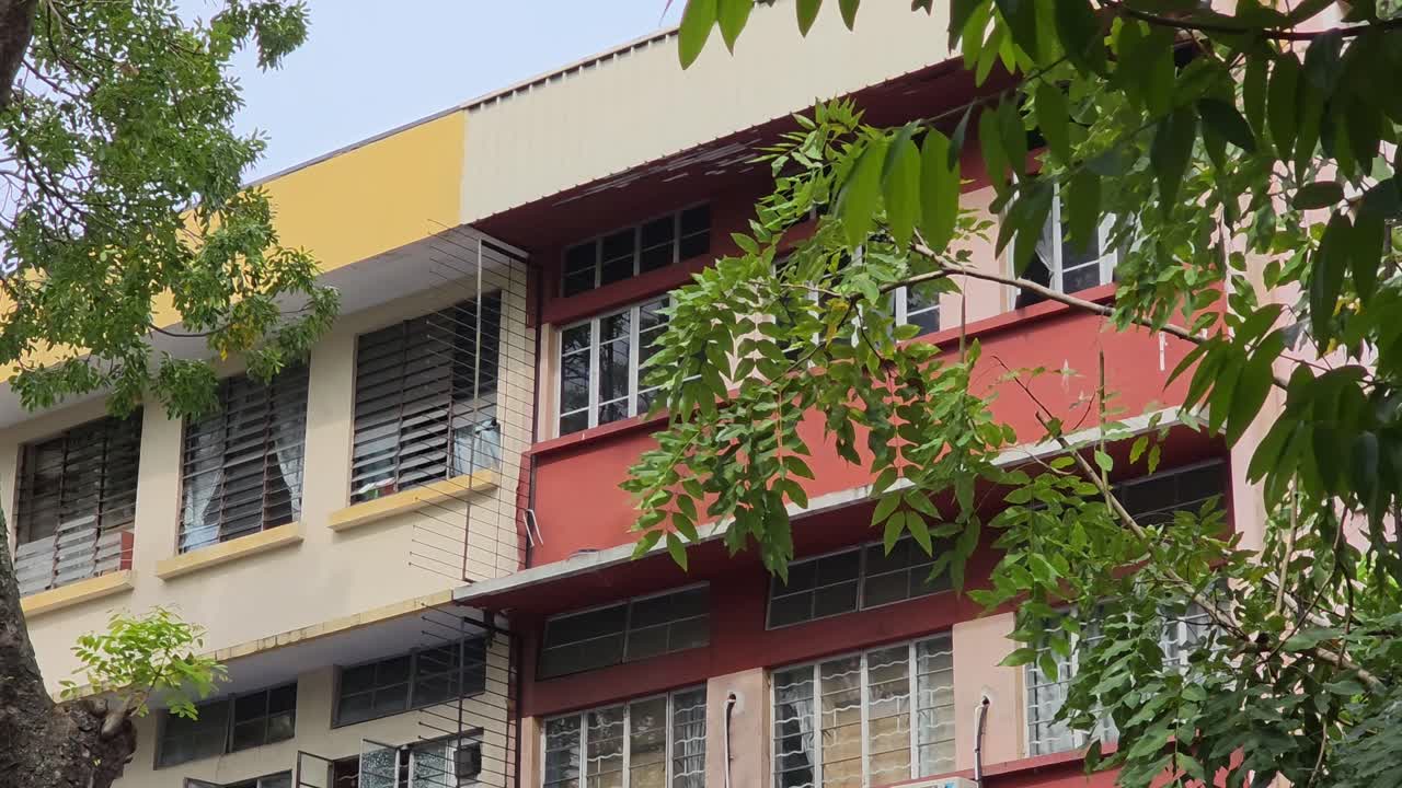 Typical Apartment Buildings Along The Gaya Street In Kota Kinabalu, Malaysia. - wide shot