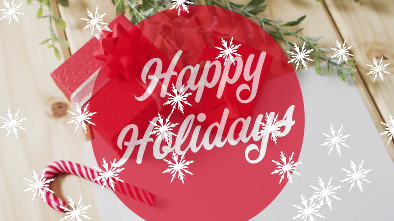 Animation of snow falling over christmas greetings text and decorations