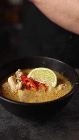 chef preparing a delicious thai green curry