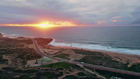 sunset bathing coastal landscape in golden light. picturesque ocean waves glow