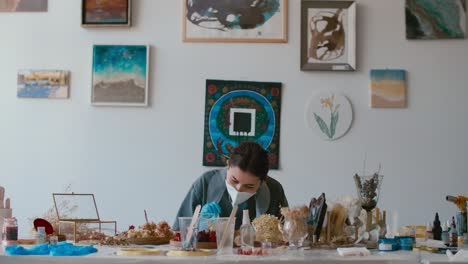 artist working in resin art studio
