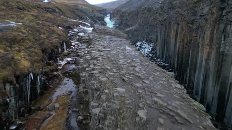 beautiful aerial view flying over studlagil canyon in iceland