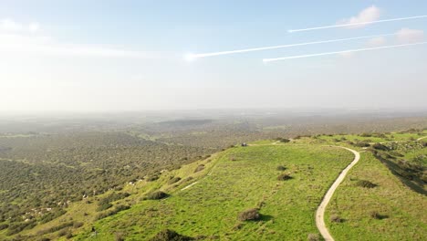 aerial view of a hilly landscape with trails