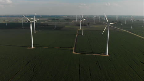 Flying-high-over-a-green-field-of-soybeans-towards-a-wind-turbine-farm-in-Iowa